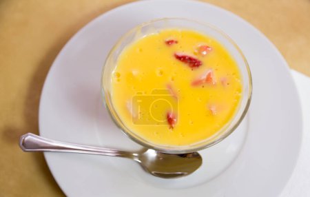 Delicate vanilla custard with fresh ripe strawberry. Delicious dessert ..