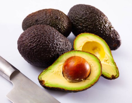 Tasty ripe avocado on a white background. Ingredients for cooking..