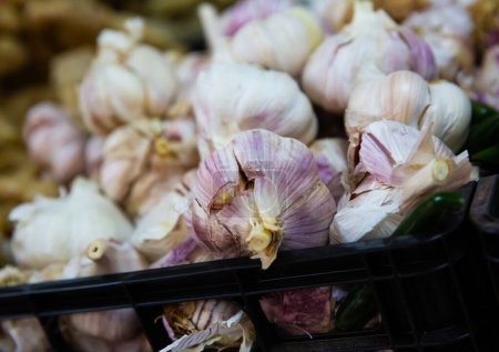 Garlic in a basket on a supermarket shelf
