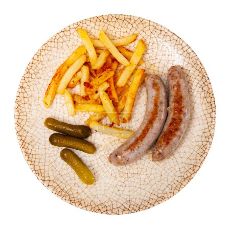 Plate of fried small pork sausage with french fries. Dish completed with appetizer pickled gherkin cucumber. Isolated over white background