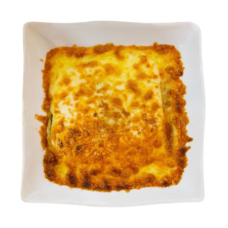 Traditional dish of Italian cuisine is meat lasagna with delicious Parmesan cheese melted on top. Isolated over white background