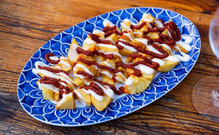 Delicious potatoes bravas spaish tapas with tomato and mayonesse sauce
