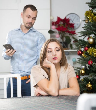 Portrait of couple offended after quarrel on the eve of Christmas