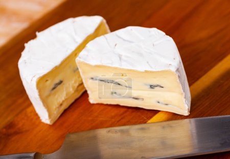 Traditional German cheese Bavaria blu with white and blue mold, cut in half, made from cows milk and enriched with cream