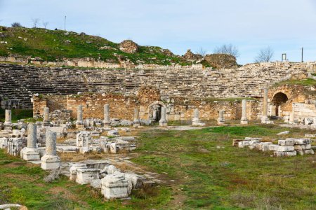 View of ruins of Theater Baths on background of ancient Odeon in Greek city of Aphrodisias in historic Caria cultural region, Turkey