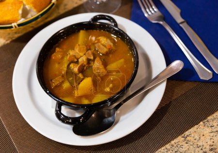 Traditional Spanish Estofado de Carne, hearty beef stew made with potatoes, carrots, onions, and other vegetables served for dinner