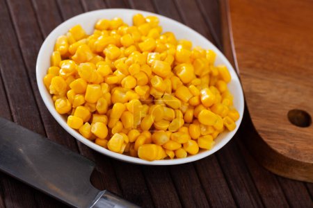 Closeup of appetizing grains boiled corn on plate