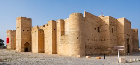 Exterior view of Ribat of Monastir, historical fortress in Tunisia, showcasing sturdy medieval Islamic architecture with high walls and strategic towers ..
