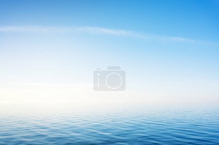 Photo for Blue sky over sea or ocean water surface. Nature background scene. - Royalty Free Image