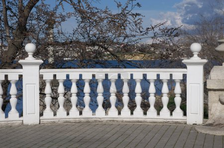 Row of white concrete balusters. Element of design. 