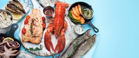 Photo for Various seafood and fishes dishes. Healthy food concept on blue background, top view, copy space, panorama, banner - Royalty Free Image