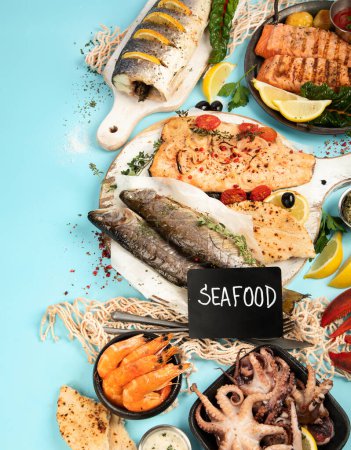 Photo for Various seafood and fishes dishes. Healthy food concept on blue background, top view, copy space - Royalty Free Image