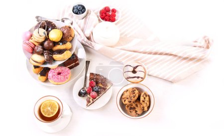 Photo for Cake stand with macaroons, mini cakes, cookies for tea. - Royalty Free Image