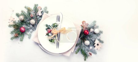 Photo for Christmas table setting with empty plate on light background. Winter Holidays conept. Top view. Copy space. Panorama, banner - Royalty Free Image