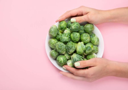 Photo for Brussels sprouts on color background.  Top view. - Royalty Free Image