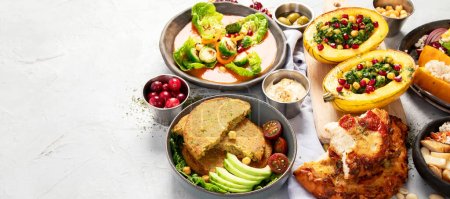 Photo for Vegetarian food concept. Various healthy vegan dishes high in vitamins, antioxidatnts, fiber on light background, top view. Panorama with copy space. - Royalty Free Image