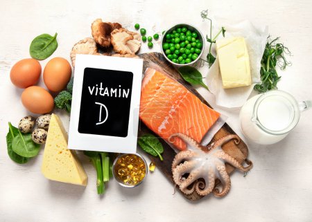 Téléchargez les photos : Composition with products rich in vitamin D on white background, top view. - en image libre de droit