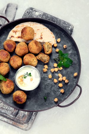 Photo for Chickpeas falafel with pita,sauce. Top view - Royalty Free Image