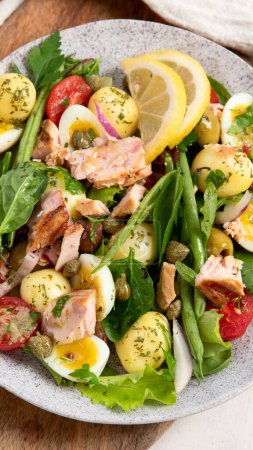 Photo for Nicoise salad,  traditional French dish. Tuna salad, healthy mediterranen diet. Top view - Royalty Free Image