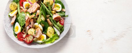 Photo for Nicoise salad,  traditional French dish. Tuna salad, healthy mediterranen diet. Top view, copy space, panorama, banner - Royalty Free Image