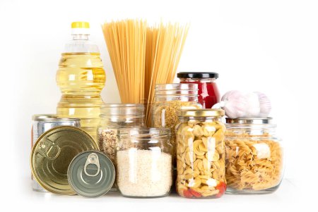 Photo for Food supplies. Crisis food stock. Different glass jars with grains, pasta, oil, nut, canned food - Royalty Free Image