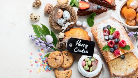 Photo for Easter desserts  table.  Sweet easter holiday concept with holiday decorations. Top view, copy space - Royalty Free Image