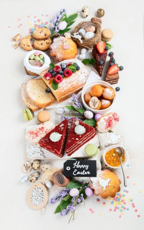 Photo for Easter desserts  table.  Sweet easter holiday concept with holiday decorations. Top view, flat lay - Royalty Free Image
