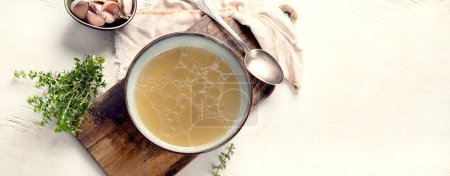 Photo for Broth in Bowl on gray background, healthy food, top view, copy space, panorama, banner, - Royalty Free Image