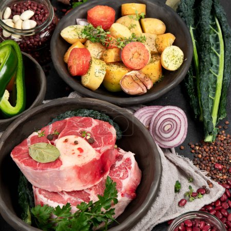 Photo for Beef and fresh vegetables for cooking, top view. Healthy and diet food concept on a dark background - Royalty Free Image