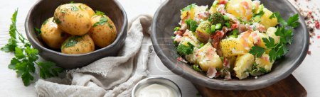 Photo for Bowl of warm potato salad with bacon on a white background. Top view. Panorama, banner. - Royalty Free Image
