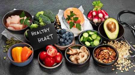 Photo for Food for a healthy heart concept and  stethoscope on black background - Royalty Free Image