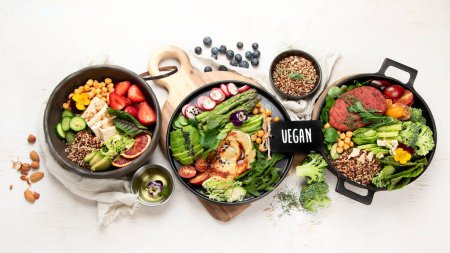 Photo for Healthy vegetarian and vegan  salads and Buddha Bowls with vitamins, antioxidants, protein on light  background. Top view, copy space - Royalty Free Image