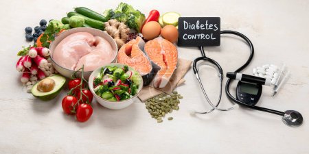 Photo for Top view of healthy food in plate with stethoscope, cholesterol diet and diabetes control on white background. World health day and medical concept. Panorama, copy space. - Royalty Free Image