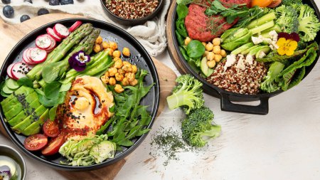 Photo for Healthy vegetarian and vegan  salads and Buddha Bowls with vitamins, antioxidants, protein on light  background. Top view, copy space - Royalty Free Image