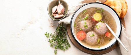 Photo for Knodel soup bowl and bread on light background. Panorama, banner - Royalty Free Image