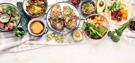 Photo for Fresh and healthy vegan table with chickpea, buddha bowl, pumpkins, broccoli, quinoa, sprout and other. Light background. Top view. Panorama with copy space. - Royalty Free Image