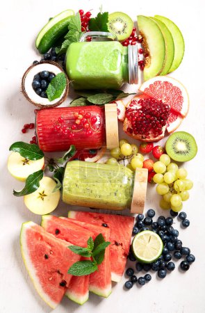 Photo for Fresh fruit and vegetable smoothies or juice  with various ingredients on light background. Top view, copy space - Royalty Free Image