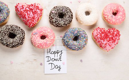 Photo for Donuts pattern. Top view of assorted glazed donuts. Colorful donuts with icing. Various colorful glazed doughnuts with sprinkles on a light background. - Royalty Free Image