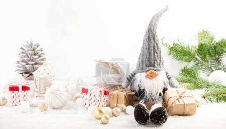 Photo for Christmas composition with gnomes and festive decorations on a white background. Christmas or New Year greeting card. Panorama. - Royalty Free Image