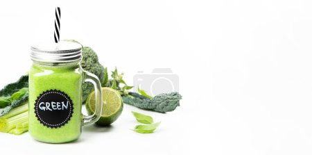 Photo for Healthy green smoothie  in a jar mug  on white background. - Royalty Free Image