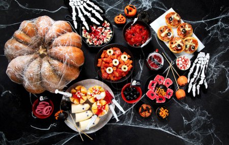 Photo for Halloween sweets for Halloween party on black background. top view, copy space - Royalty Free Image
