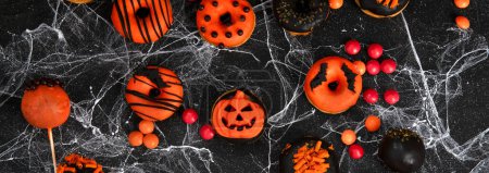 Photo for Halloween sweets for Halloween party on black background. top view. - Royalty Free Image