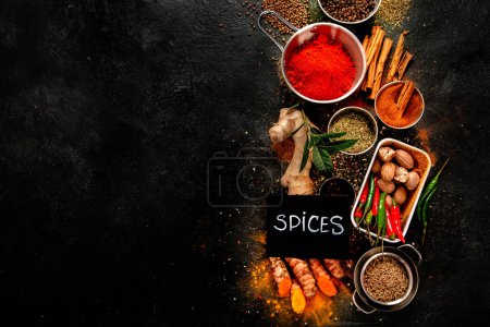 Photo for Spices on dark background. Different varius. Top view, copy space. - Royalty Free Image