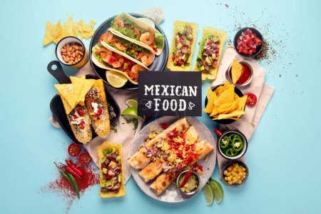 Photo for Mexican food, many dishes of the cuisine of Mexico on a blue background. Top view. - Royalty Free Image