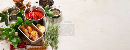Photo for Variety of spices and herbs on a light background. Top view. Copy space. - Royalty Free Image