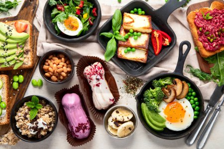 Photo for Healthy vegan food. Mushrooms, tofu, avocado and edamame beans. Top view. - Royalty Free Image