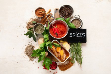 Photo for Variety of spices and herbs on a light background. Top view. - Royalty Free Image