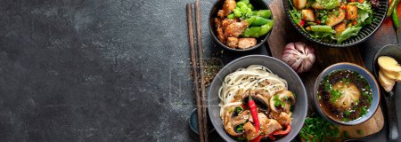 Photo for Asian food background with various ingredients on a black background, top view. Panorama with copy space. - Royalty Free Image