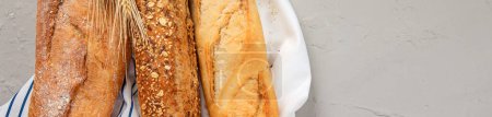 Photo for Fresh baguette bread on light background. Traditional French food. - Royalty Free Image