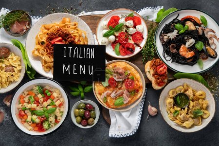 Photo for Italian food dishes on dark background. Traditional food concept. Top view. - Royalty Free Image